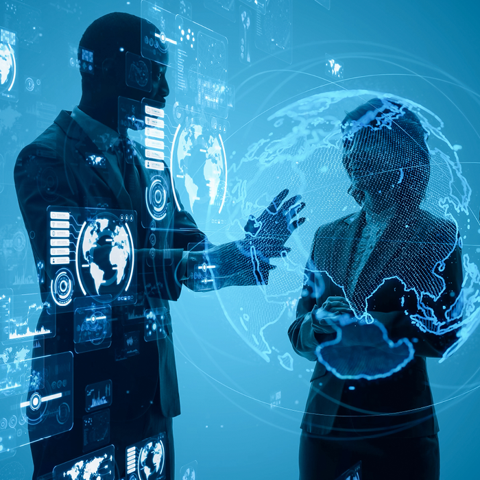 Image of a man and woman standing behind an interactive screen. There is an image of the earth on the screen